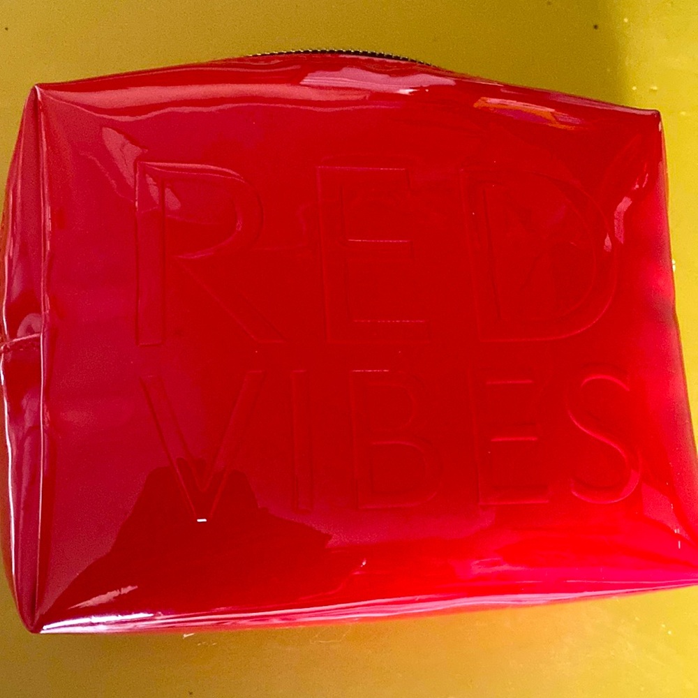 Red Vibes YSL makeup bag